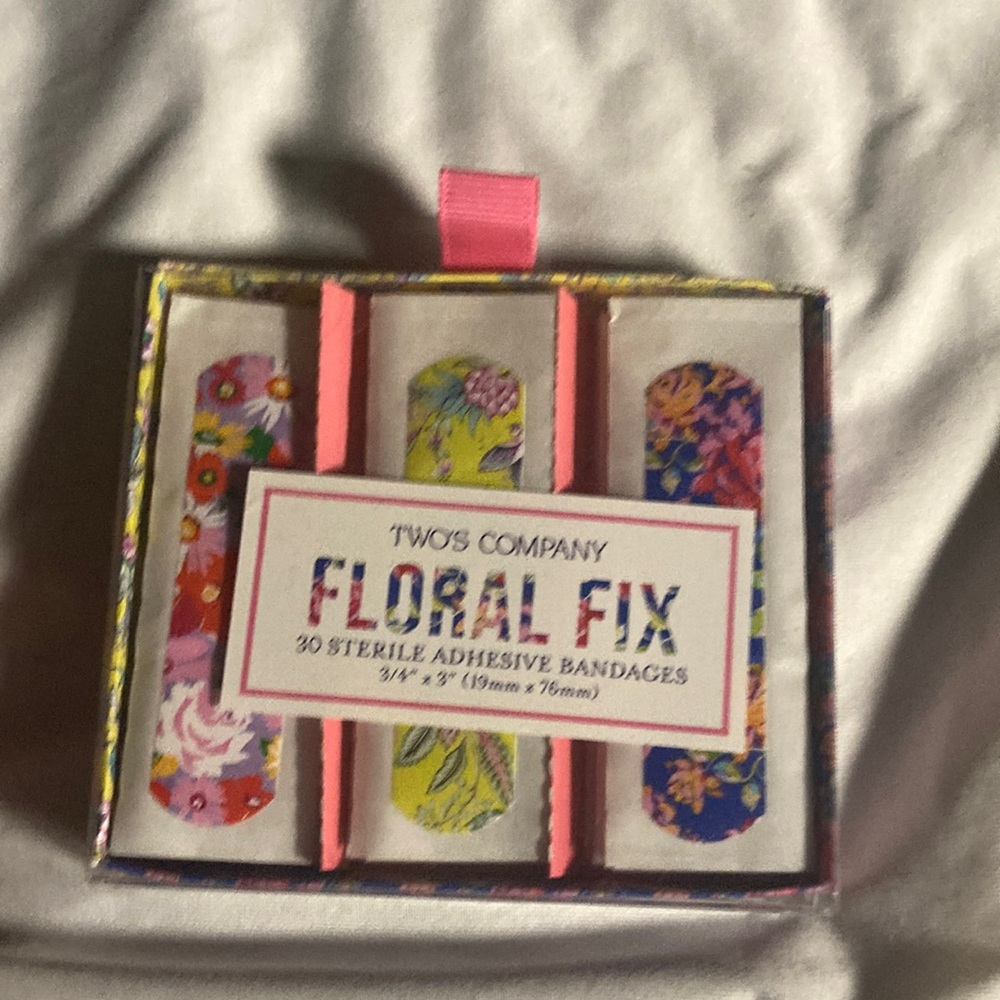 Two’s Company floral fix Bandages with a floral pattern